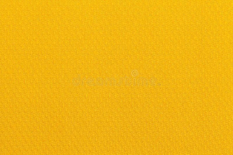 Jasnożółty ocher tło od tekstylnego materiału Tkanina z naturalną teksturą tło fotografia stock Jasnożółty ocher tło od tekstylnego materiału Tkanina z naturalną teksturą tło fotografia stock