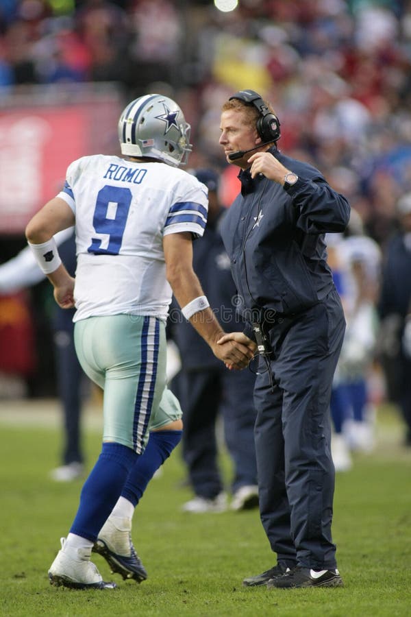 Dallas Cowboys head coach Jason Garrett shakes the hand of his quarterback Tony Romo. Dallas Cowboys head coach Jason Garrett shakes the hand of his quarterback Tony Romo.