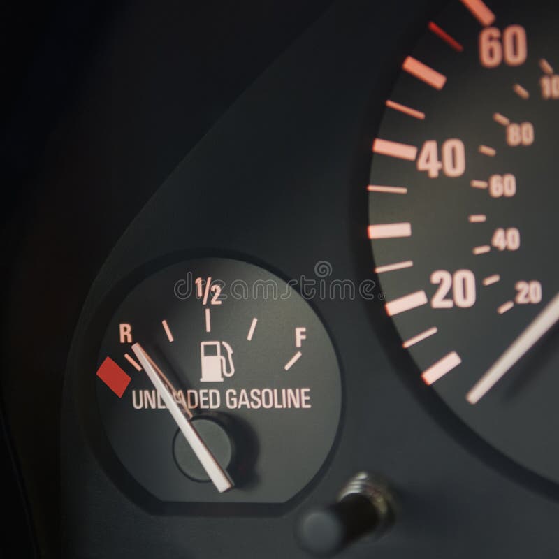 Closeup of automobile fuel gauge on empty with speedometer at zero. Closeup of automobile fuel gauge on empty with speedometer at zero