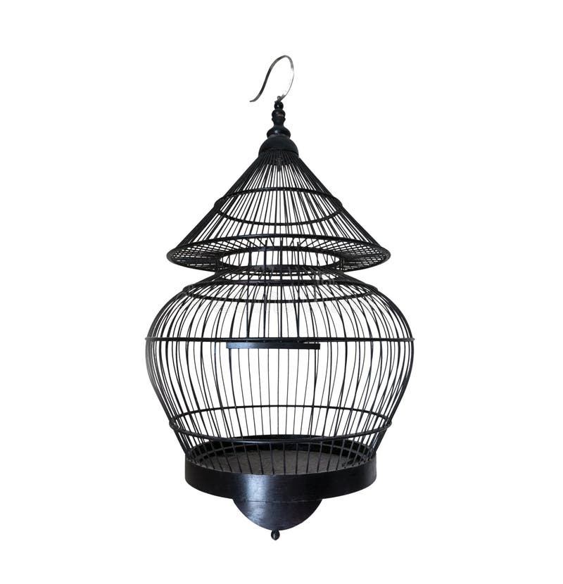 Old black bird cage, beautifully crafted with wire, but still a symbol of loss of freedom. Old black bird cage, beautifully crafted with wire, but still a symbol of loss of freedom