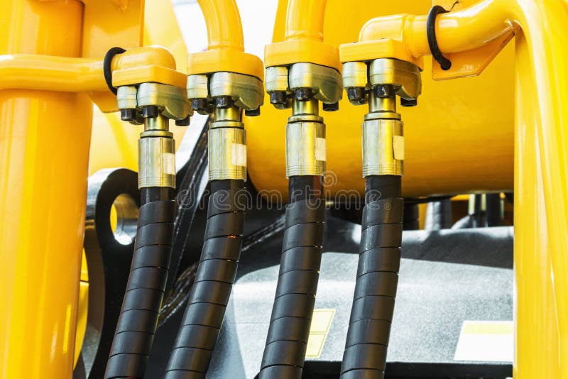 Jaune de tracteur de l'hydraulique image stock Jaune de tracteur de l'hydraulique image stock