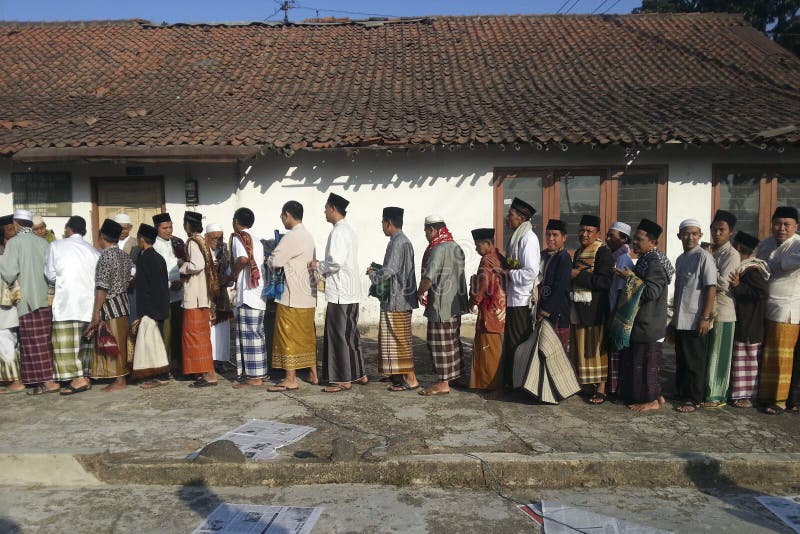 Javanese Muslims are shaking hands after Eid Prayer in Banjarnegara, Java, Indonesia. Javanese are an ethnic group native to the Indonesian island of Java. At approximately 100 million people (as of 2011), they form the largest ethnic group in Indonesia. . The Javanese language belongs to the Austronesian (Malayo-Polynesian) family. Islam is the predominant religion, though Hindu traditions of an earlier era are still evident in many areas, and relatively few Javanese strictly observe Muslim precepts. Belief in assorted local spirits is widespread. Javanese Muslims are shaking hands after Eid Prayer in Banjarnegara, Java, Indonesia. Javanese are an ethnic group native to the Indonesian island of Java. At approximately 100 million people (as of 2011), they form the largest ethnic group in Indonesia. . The Javanese language belongs to the Austronesian (Malayo-Polynesian) family. Islam is the predominant religion, though Hindu traditions of an earlier era are still evident in many areas, and relatively few Javanese strictly observe Muslim precepts. Belief in assorted local spirits is widespread.