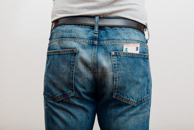 Jeans con soldi in tasca fotografia stock Jeans con soldi in tasca fotografia stock