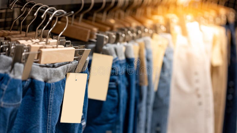 Jeans Hanging on Rack in Clothes Shop Stock Photo - Image of ...