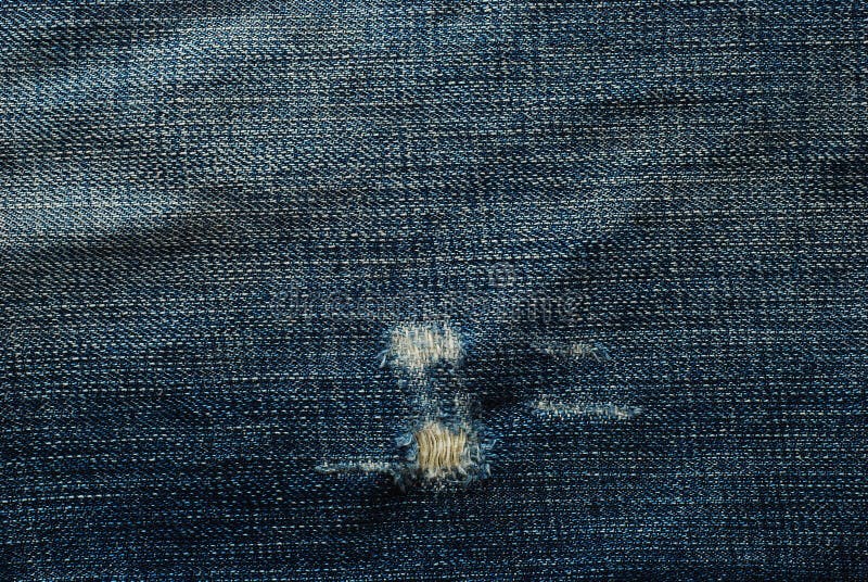 Jeans strappati immagine stock. Immagine di cotone, tessile - 15770575