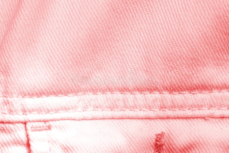 Close Up Surface Background Of Pink Jeans Fabric Texture. Stock