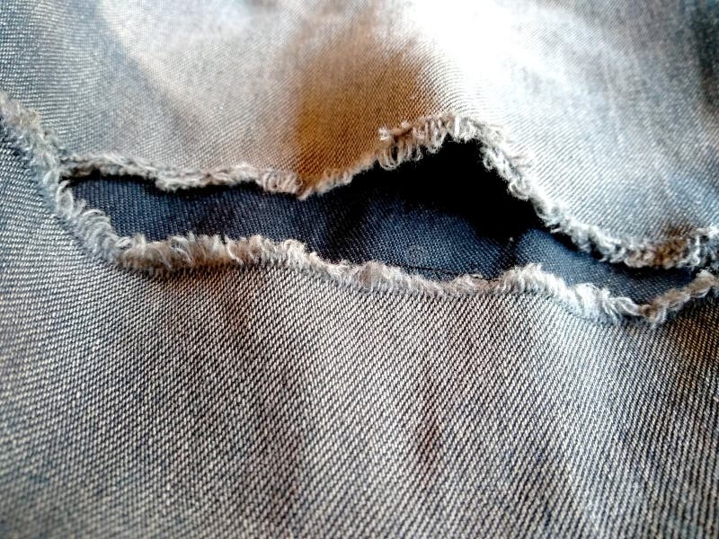 Jeans zerrissene Denim-Textur. zerstörter Jeanenhintergrund lizenzfreie stockfotografie