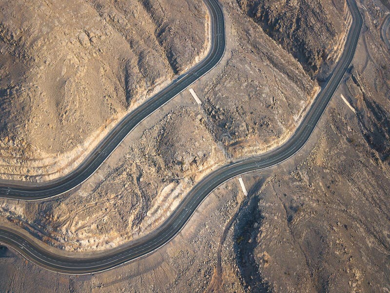 Jebel Jais mountain desert highway road in Ras al Khaimah UAE aerial view