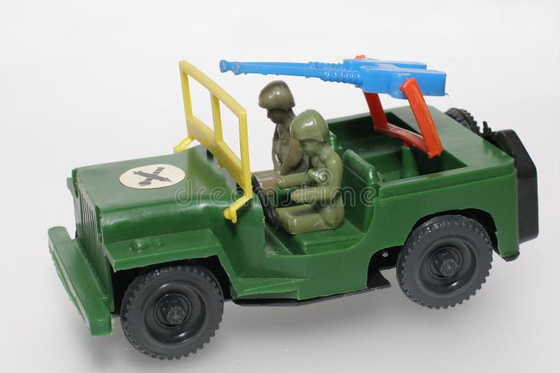  Jeep Militar Verde Del Juguete Con El Arma Foto de archivo