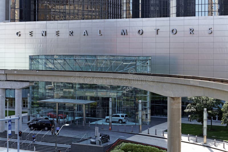 Detroit, MI, USA â€“ July 31, 2014: People exit the General Motors World Headquarters building located in Detroit, Michigan. General Motors is an American multinational automobile corporation. Detroit, MI, USA â€“ July 31, 2014: People exit the General Motors World Headquarters building located in Detroit, Michigan. General Motors is an American multinational automobile corporation.