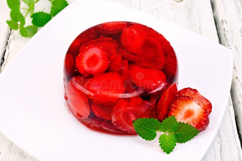 Jelly strawberry with mint on board