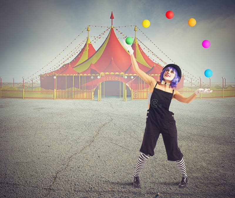 Jester clown in front of circus tent