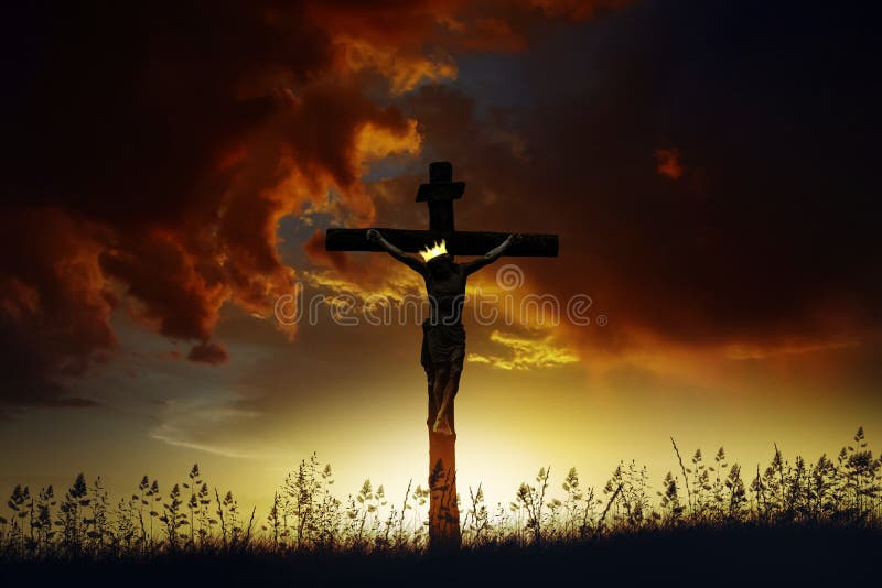 Jesus Christ death on cross crucifixion on calvary hill at sunrise with dark clouds