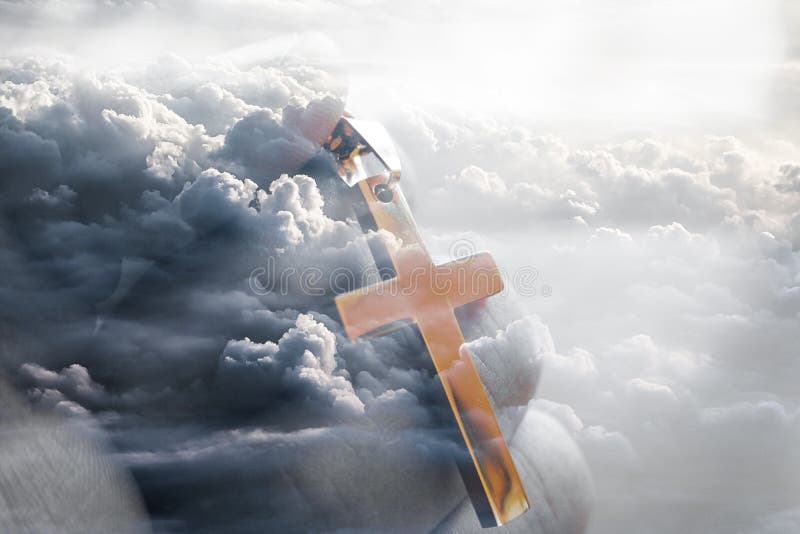 Jesus Christ Golden Cross In Hand With Clouds In Background High Quality Stock Photo