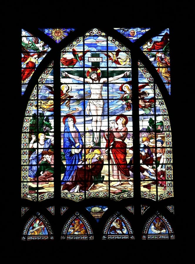 Jesus on the cross, glass painting. In church stock images