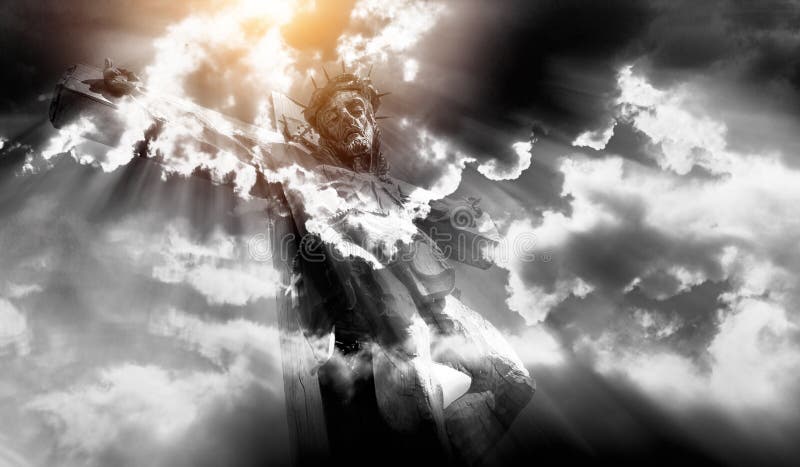 Wooden Jesus crucified with clouds and sun background