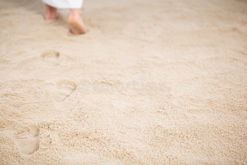 Jesus leaving footprints in sand. Jesus Christ walking and leaving footrpints in sand royalty free stock photo Jesus leaving footprints in sand. Jesus Christ walking and leaving footrpints in sand royalty free stock photo