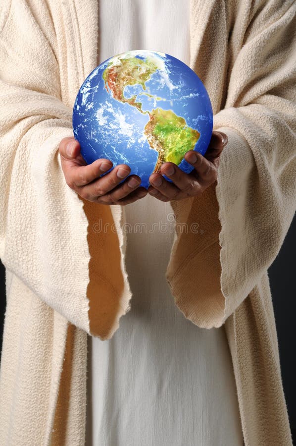 Jesus passa la terra della holding immagini stock Jesus passa la terra della holding immagini stock