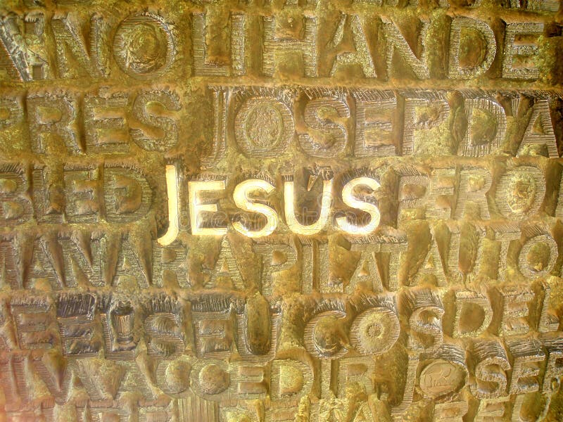 Jesus written in metallic letters. There are several other letters, but the letters Jesus stands out. Jesus written in metallic letters. There are several other letters, but the letters Jesus stands out