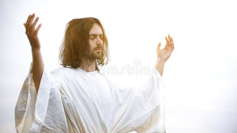 Jesus som lyser upp händer med ljus, återupplivning och Guds upphängning arkivfoton Jesus som lyser upp händer med ljus, återupplivning och Guds upphängning arkivfoton