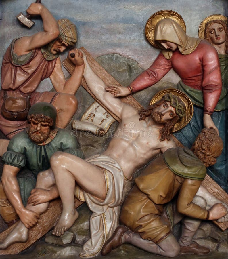 Jesus is nailed to the cross, 11th Stations of the Cross, the parish church of St. Peter and Paul in Oberstaufen, Germany. Jesus is nailed to the cross, 11th Stations of the Cross, the parish church of St. Peter and Paul in Oberstaufen, Germany.