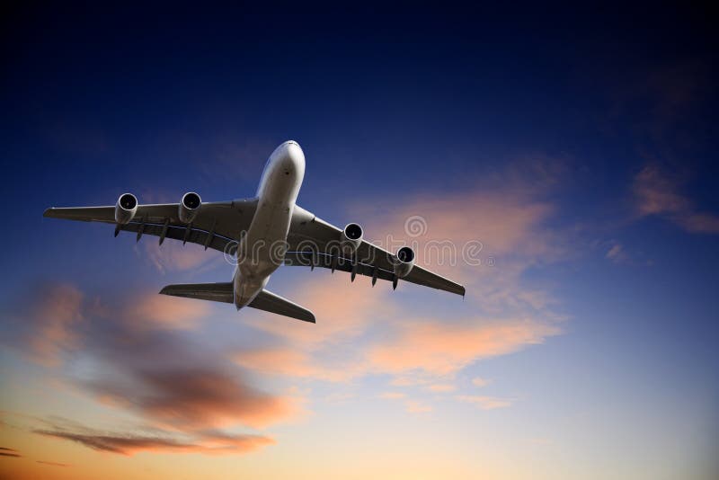 Jet Airplane Taking Off into Bright Twilight Sky