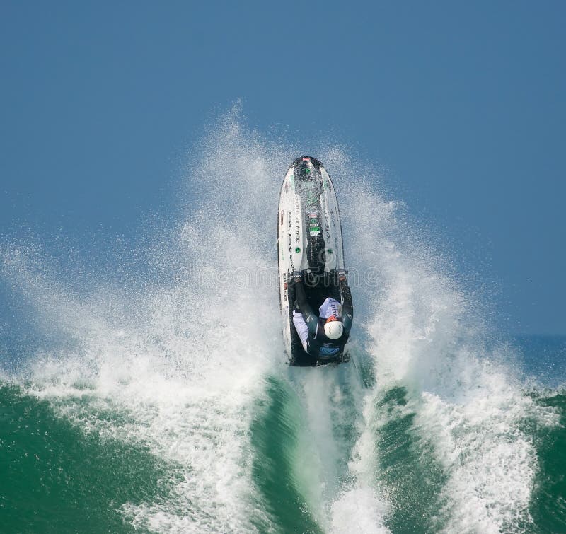 Jet ski in the waves editorial photo. Image of flying 13592756