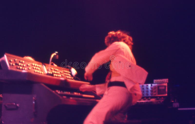 The Picture show John Evan playing his piano and organ. The picture was made during a concert in â€œFalconer Salenâ€ in Copenhagen, Denmark, on the 5th. of December 1974. The Picture show John Evan playing his piano and organ. The picture was made during a concert in â€œFalconer Salenâ€ in Copenhagen, Denmark, on the 5th. of December 1974.