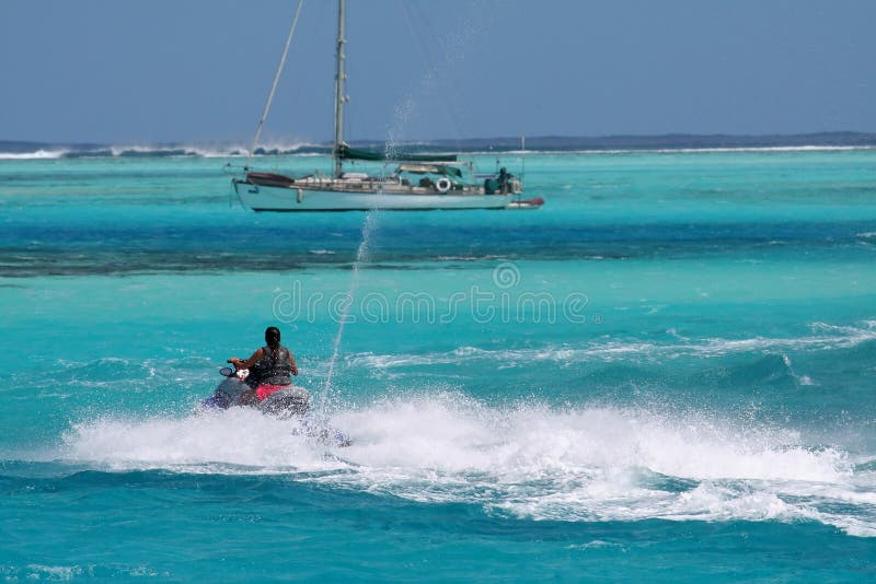 Jetski passing a sailboat