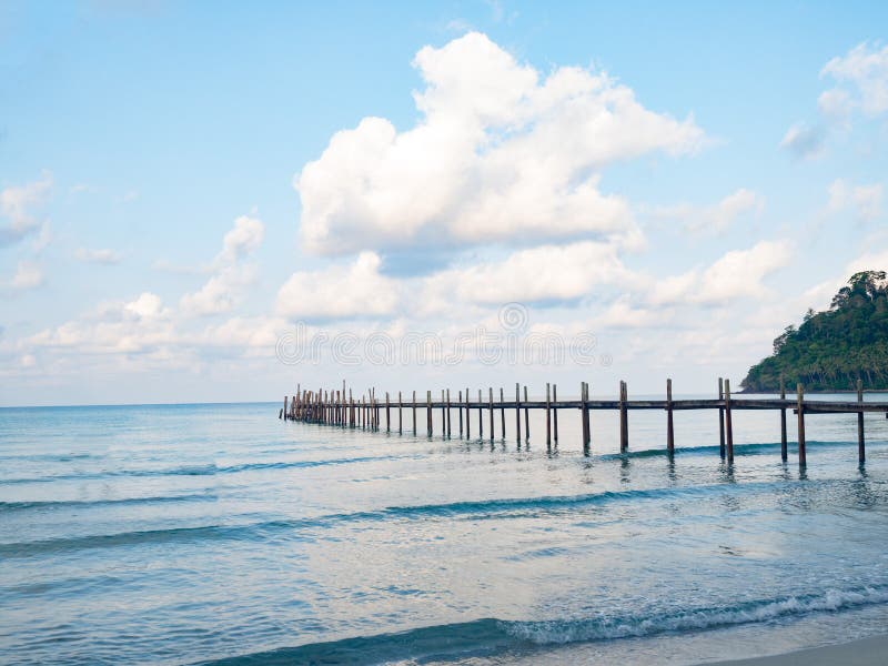 Jetty wooden bridge into blue sea and sky. Pier over water. Vacation And tourism concept. Tropical resort. Jetty on Koh Kood royalty free stock images Jetty wooden bridge into blue sea and sky. Pier over water. Vacation And tourism concept. Tropical resort. Jetty on Koh Kood royalty free stock images