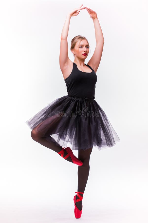Jeune beau danseur de ballerine posant sur un fond de studio image stock Jeune beau danseur de ballerine posant sur un fond de studio image stock