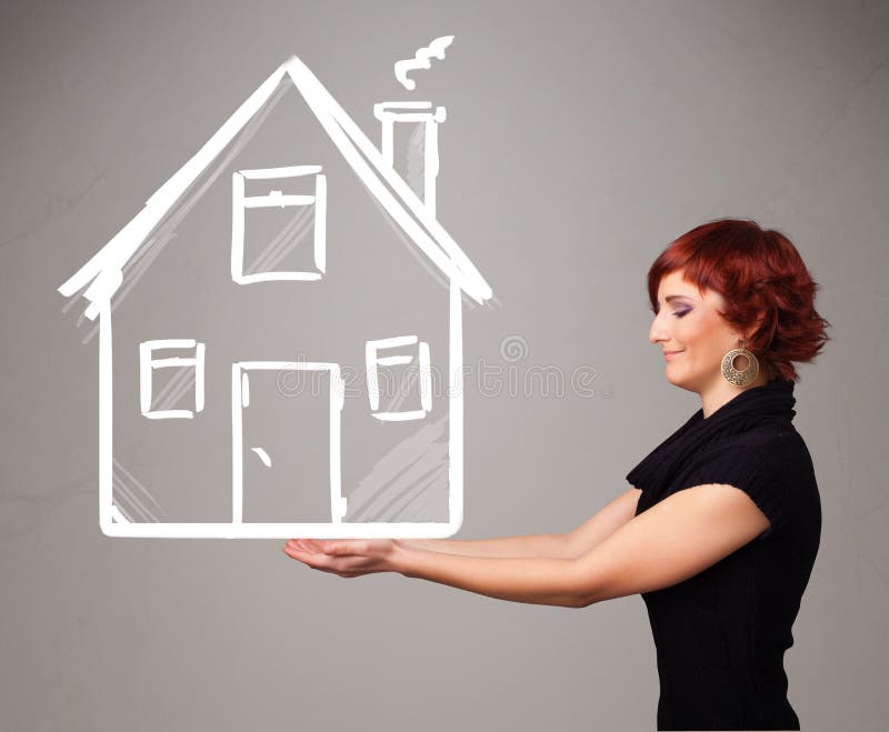 Beautiful young lady holding a huge drawn house. Beautiful young lady holding a huge drawn house