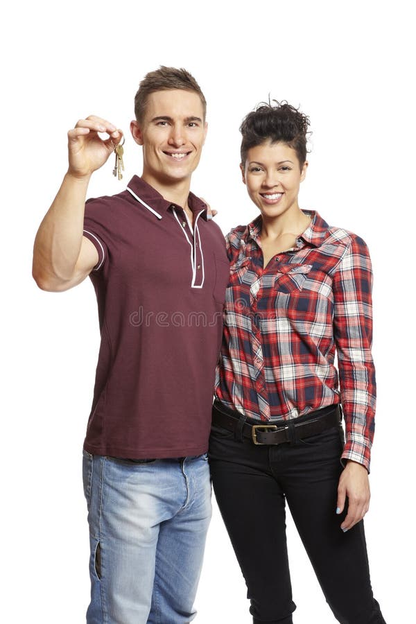 Jeune ensemble de fixation de couples de clés de maison photos libres de droits Jeune ensemble de fixation de couples de clés de maison photos libres de droits