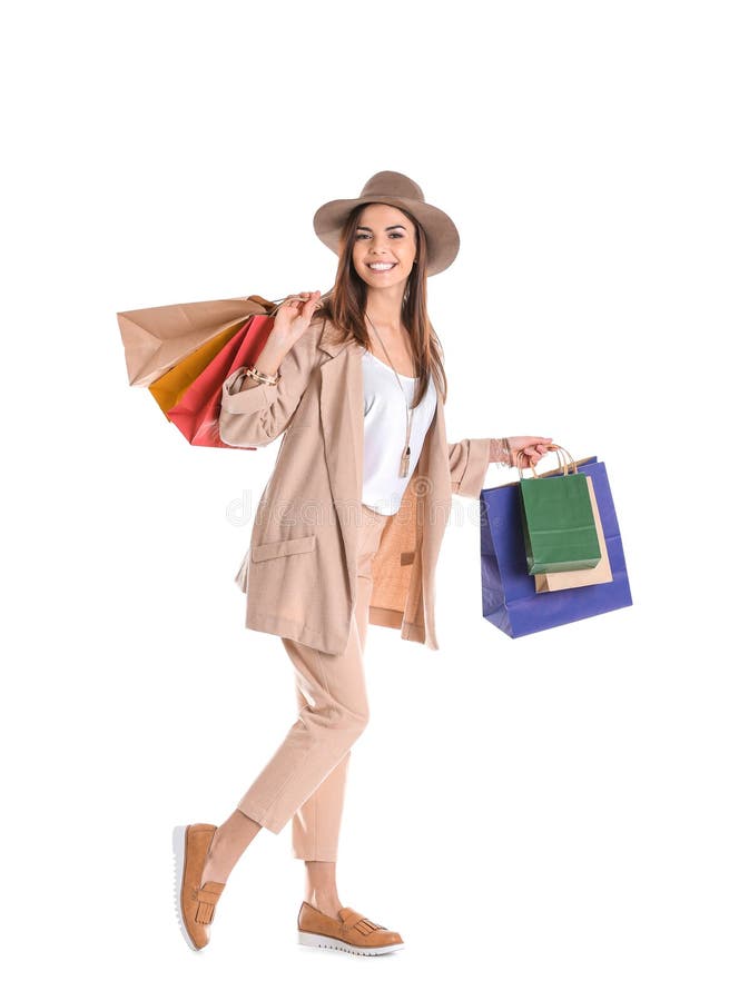 Jeune femme avec des sacs à provisions image stock Jeune femme avec des sacs à provisions image stock