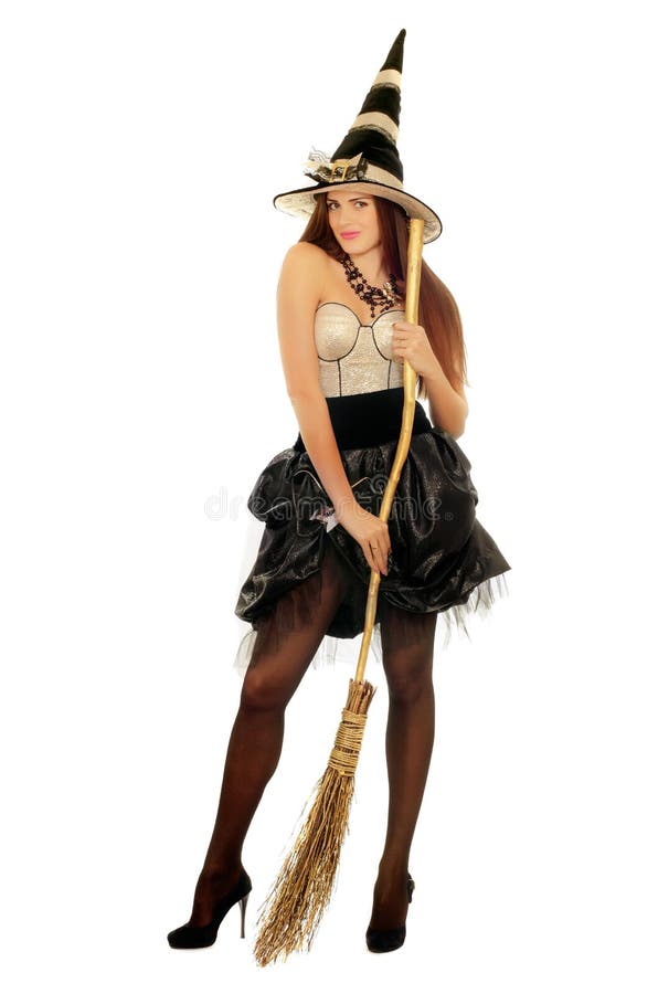 Young woman with a besom wearing costume witch. Young woman with a besom wearing costume witch