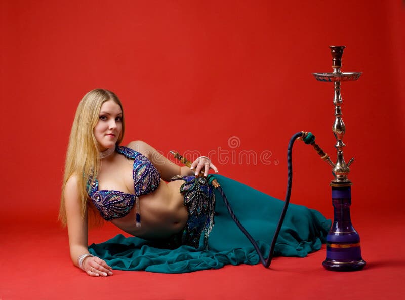 Beauty young woman with hookah on red. Beauty young woman with hookah on red