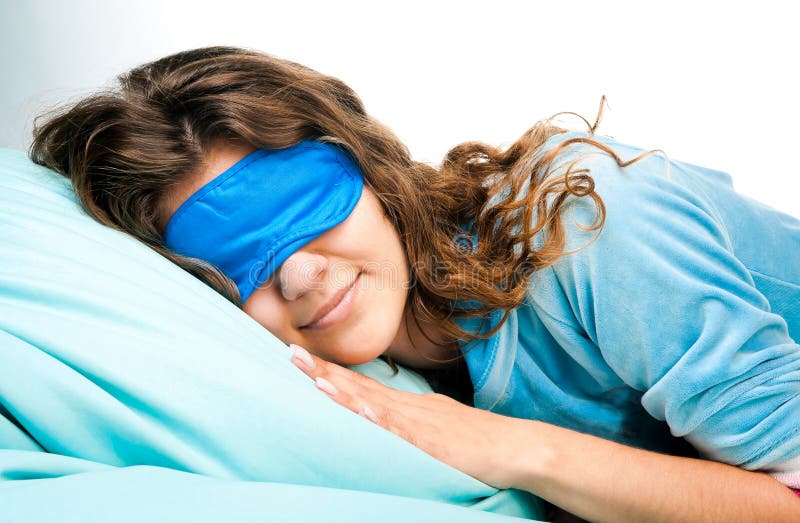 Jeune femme de sommeil dans le masque d'oeil de sommeil photographie stock Jeune femme de sommeil dans le masque d'oeil de sommeil photographie stock