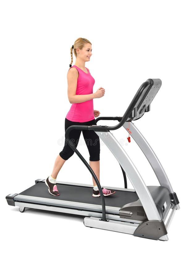 Jeune femme faisant des exercices sur le tapis roulant photos libres de droits Jeune femme faisant des exercices sur le tapis roulant photos libres de droits