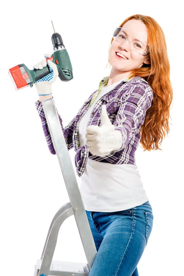 jeune femme heureuse avec un outil sur un blanc images libres de droits jeune femme heureuse avec un outil sur un blanc images libres de droits