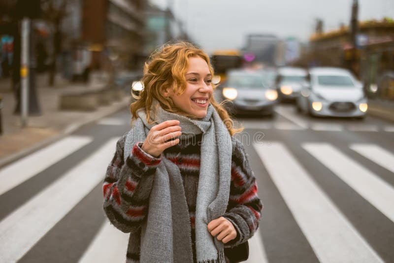 Young woman on a crosswalk in Warsaw, Poland. Young woman on a crosswalk in Warsaw, Poland