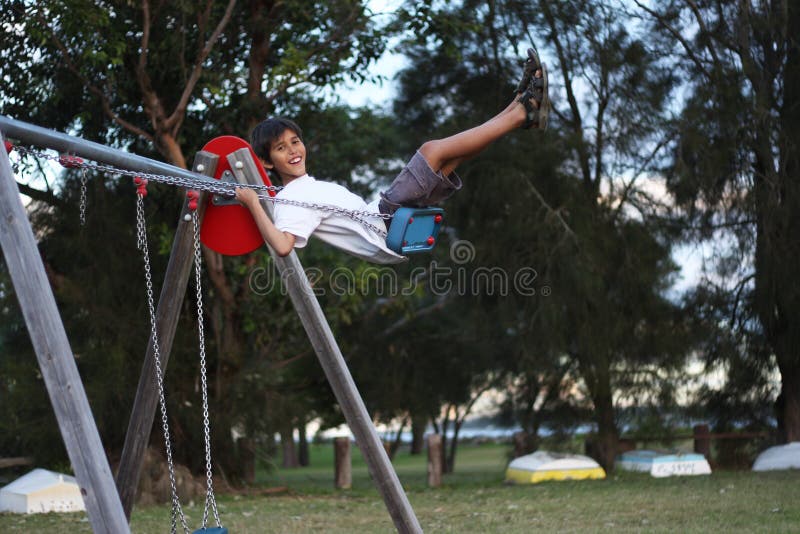 Young boy on a swing. Young boy on a swing