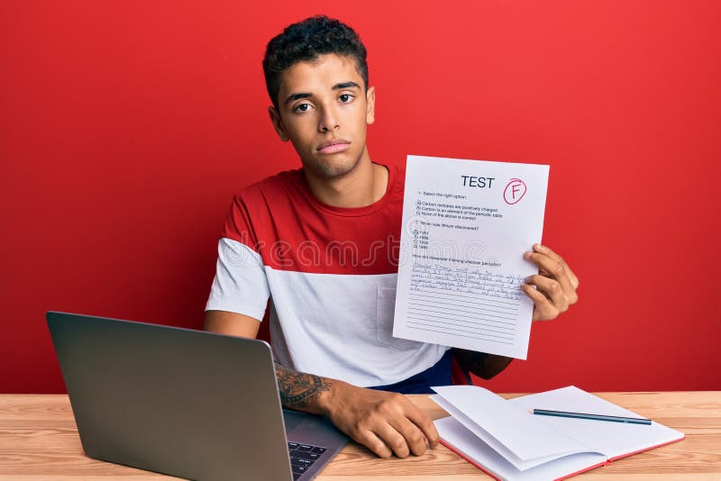 Young handsome african american man showing failed exam thinking attitude and sober expression looking self confident. Young handsome african american man showing failed exam thinking attitude and sober expression looking self confident