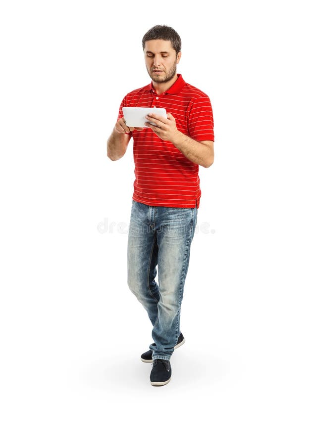 Jeune homme beau à l'aide de la tablette photos stock Jeune homme beau à l'aide de la tablette photos stock
