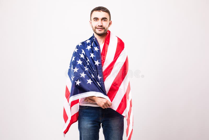 Jeune homme bel avec le drapeau américain image libre de droits Jeune homme bel avec le drapeau américain image libre de droits