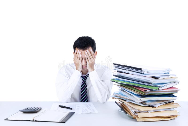 Jeune homme d'affaires accablé photo stock Jeune homme d'affaires accablé photo stock