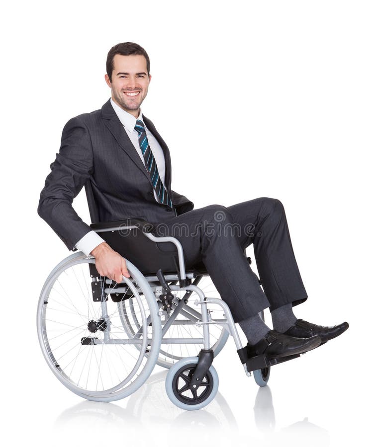 Jeune homme d'affaires dans le fauteuil roulant photos stock Jeune homme d'affaires dans le fauteuil roulant photos stock