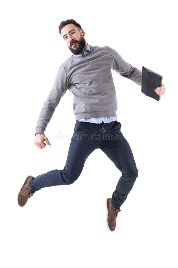 Jeune homme d'affaires enthousiaste joyeux célébrant le succès et sauter photos stock Jeune homme d'affaires enthousiaste joyeux célébrant le succès et sauter photos stock