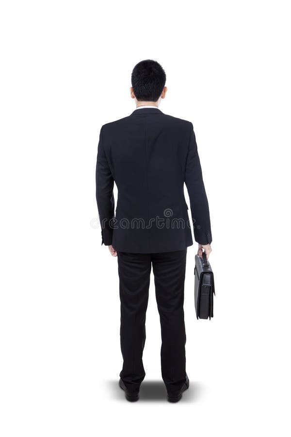 Jeune homme d'affaires se tenant avec la serviette - d'isolement image stock Jeune homme d'affaires se tenant avec la serviette - d'isolement image stock