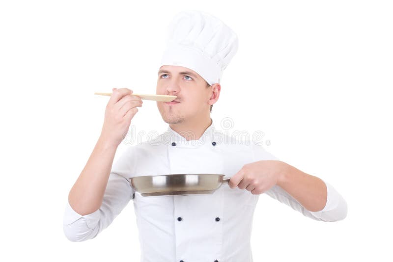 Jeune homme dans l'échantillon uniforme de chef quelque chose d'isolement sur le blanc photographie stock Jeune homme dans l'échantillon uniforme de chef quelque chose d'isolement sur le blanc photographie stock