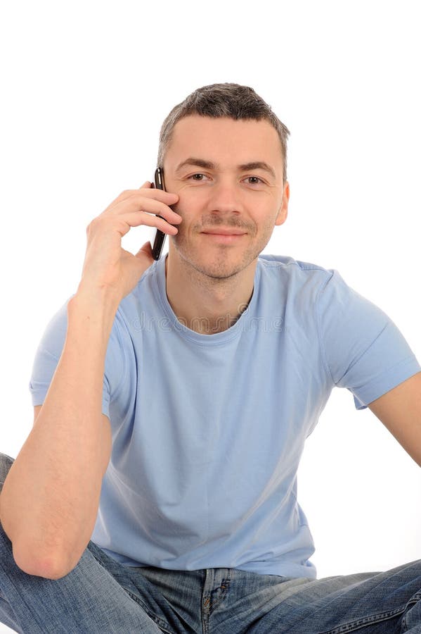 Jeune homme occasionnel avec le téléphone portable photos libres de droits Jeune homme occasionnel avec le téléphone portable photos libres de droits